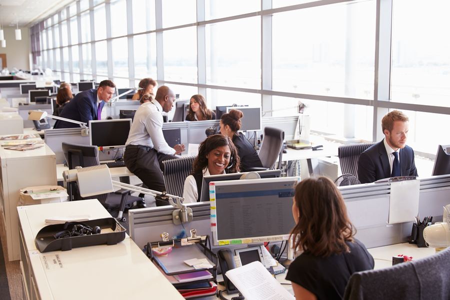 Colleagues working together in a busy office