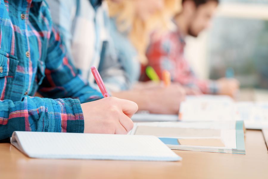 Students writing during an exam