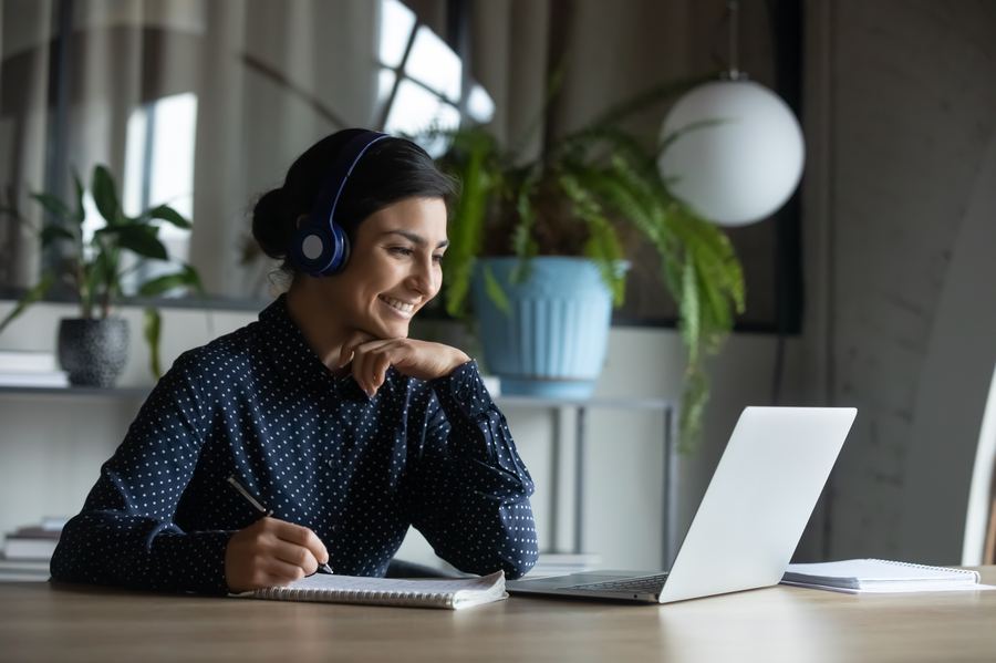 Student smiling during an online conversation class