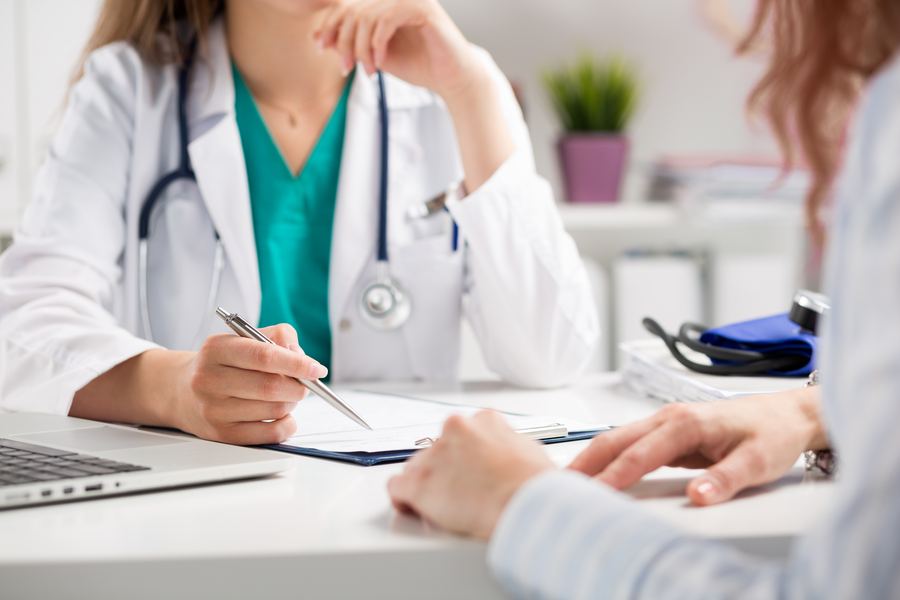 A doctor consulting with a patient